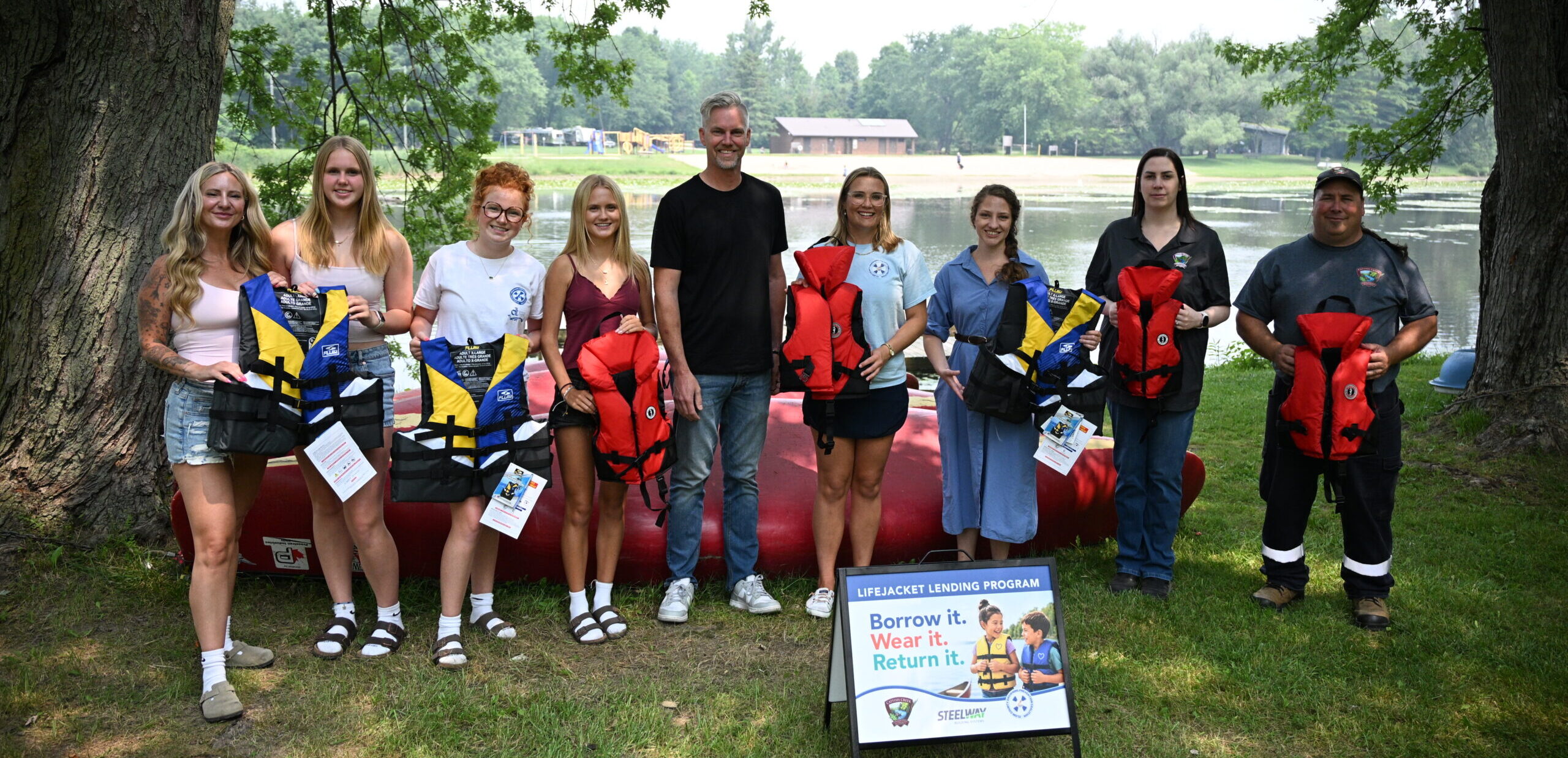 From left, Rebecca White of Steelway Building Systems, Ayla White, Harlee Vachon, Paisley Vachon and Brian White of Steelway, joined Briar McCaw of the Elgin County Drowning Prevention Coalition, Central Elgin Councillor Morgaine Griffin and Brittany Bell and Al Bradford with Catfish Creek Conservation Authority for the launch of a lifejacket lending program at Springwater Conservation Area on Friday, July 17. Steelway, alongside Canadian Tire in Aylmer, donated child and adult-sized lifejackets to Catfish Creek Conservation Authority to hand out to those in need of one at Springwater. A similar program is already operational at Port Stanley’s main beach. (AE/Hayden King)