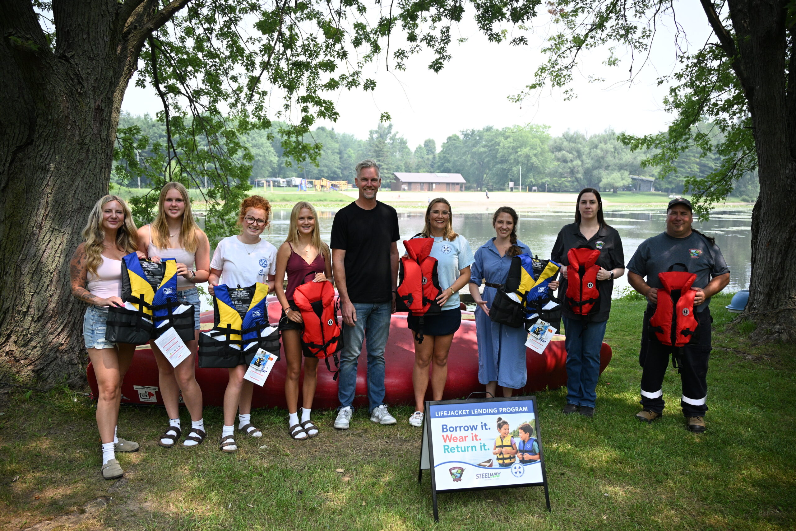 From left, Rebecca White of Steelway Building Systems, Ayla White, Harlee Vachon, Paisley Vachon and Brian White of Steelway, joined Briar McCaw of the Elgin County Drowning Prevention Coalition, Central Elgin Councillor Morgaine Griffin and Brittany Bell and Al Bradford with Catfish Creek Conservation Authority for the launch of a lifejacket lending program at Springwater Conservation Area on Friday, July 17. Steelway, alongside Canadian Tire in Aylmer, donated child and adult-sized lifejackets to Catfish Creek Conservation Authority to hand out to those in need of one at Springwater. A similar program is already operational at Port Stanley’s main beach. (AE/Hayden King)